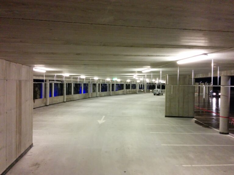 An inside of a finished parking building.